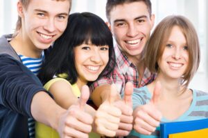 Young people giving a thumbs up about Mind Lab Pro customer reviews