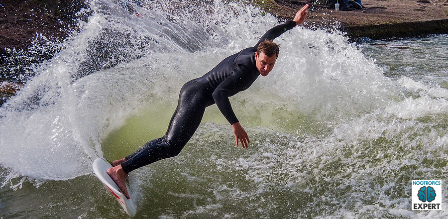 young man surfing. best energy supplements for chronic fatigue